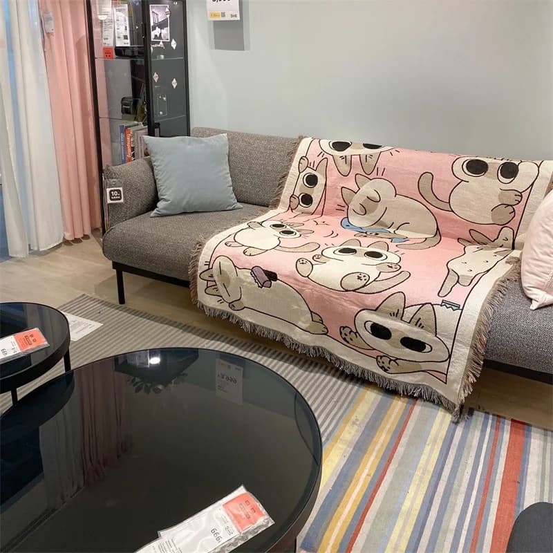 Rosa teppe med tegneseriekatt for énseters sofa