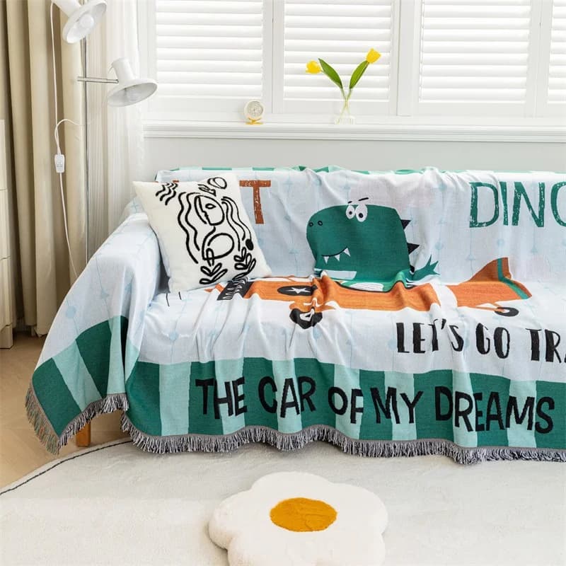 Sofatrekk med tegneserie-dinosaur og dusker